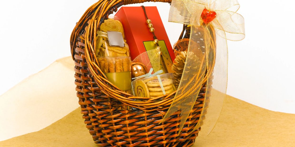 A Gourmet Gift Basket with cookies, chips, chocolates, nuts, and dried fruit.