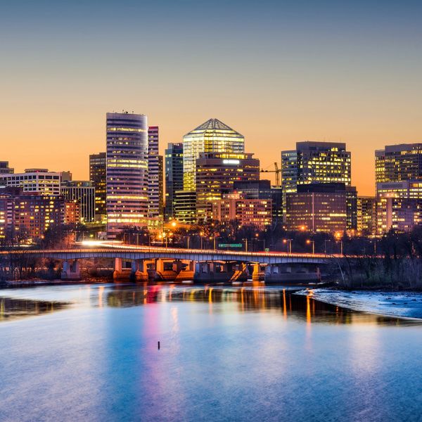 Arlington skyline at dusk overlooking the Potomac, highlighting major federal event venues.