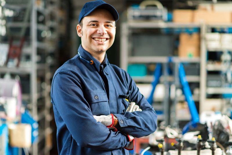 Portrait of a mechanic in his garage