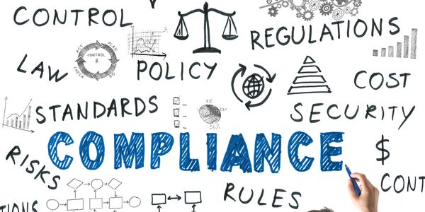 Illustration showing key terms related to compliance and regulations with a person writing.