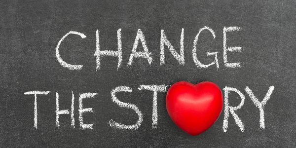 Chalkboard message with red heart saying 'Change the Story.'