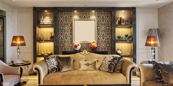 Luxurious living room with velvet sofa and elegant lighting.
