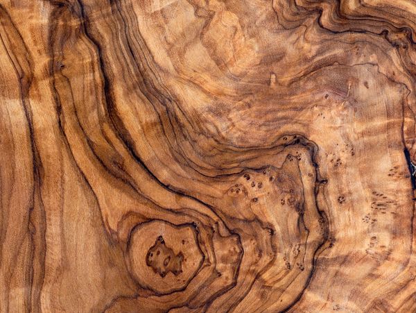 Close-up of polished wood grain with intricate patterns.