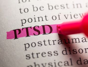 The word PTSD highlighted with pink marker.