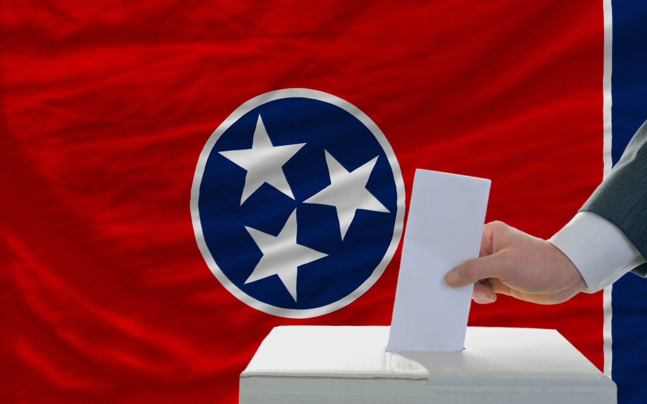 Voting with a TN flag in the background