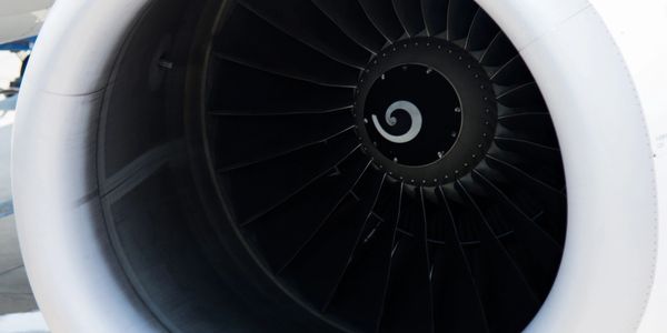 Close-up of a commercial airplane jet engine turbine blades.
