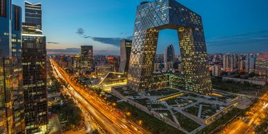 CCTV Headquarters lit up at twilight in Beijing.