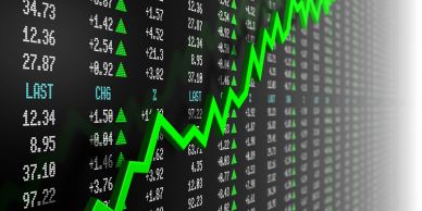 Stock market data with a rising green trend line.