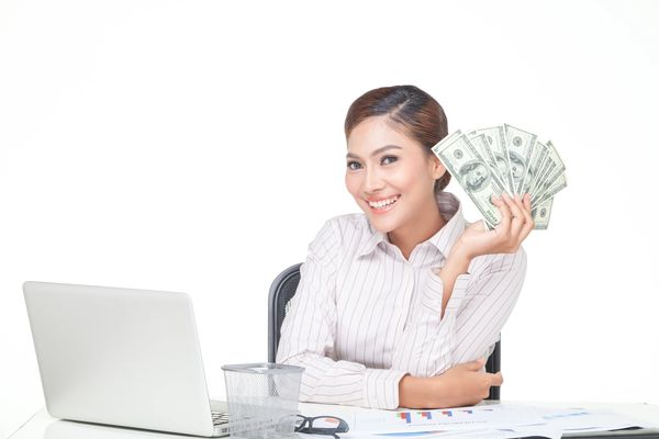 Making money online from home with a laptop.