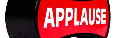 A large red button labeled 'APPLAUSE'.