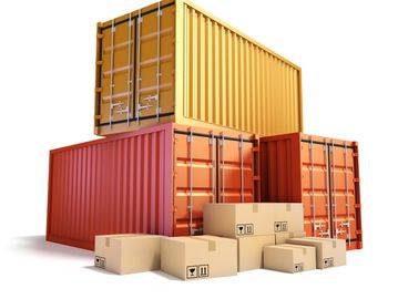 Stacked cargo containers and cardboard boxes.