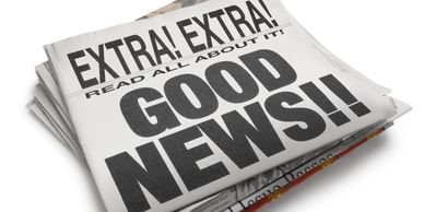 A stack of newspapers with a headline saying GOOD NEWS!!