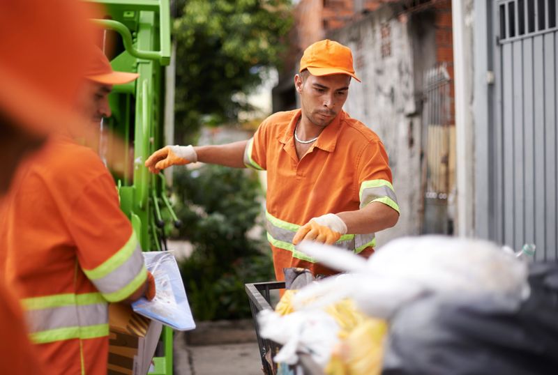 Cropped shot of a garbage collection team at work