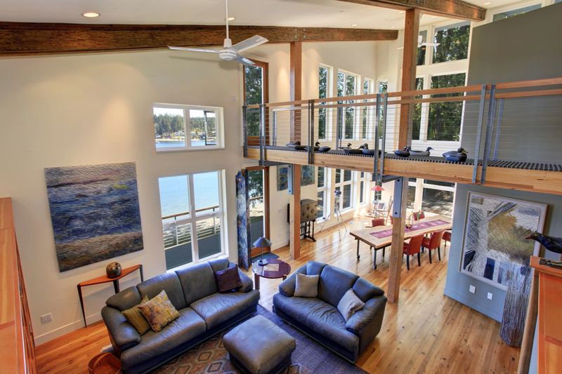 Modernized living room of amazing home with fireplace, and leather sofas.