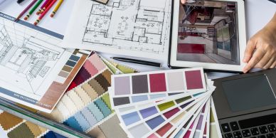 Interior design tools and color swatches on a workspace.