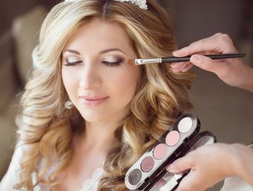 Bride getting eye makeup applied.