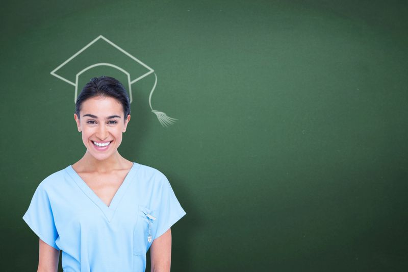 Young nurse in blue tunic  against green