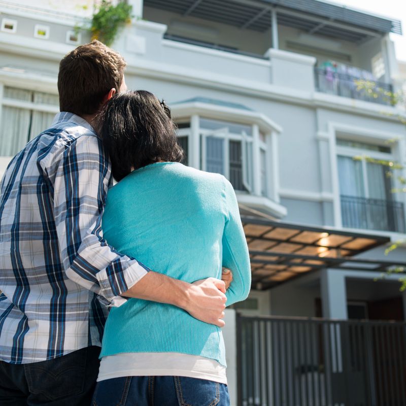 Young family looking at the house