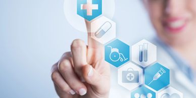 Person interacting with digital healthcare icons.