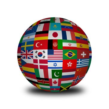 A globe made of various international flags on a white background.
