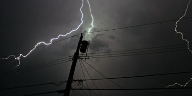 Lightning striking a power line transformer.