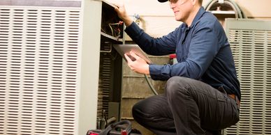 Technician repairing an HVAC unit.