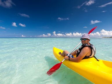 Kayaking in the warm crystal clear waters of the Maldives