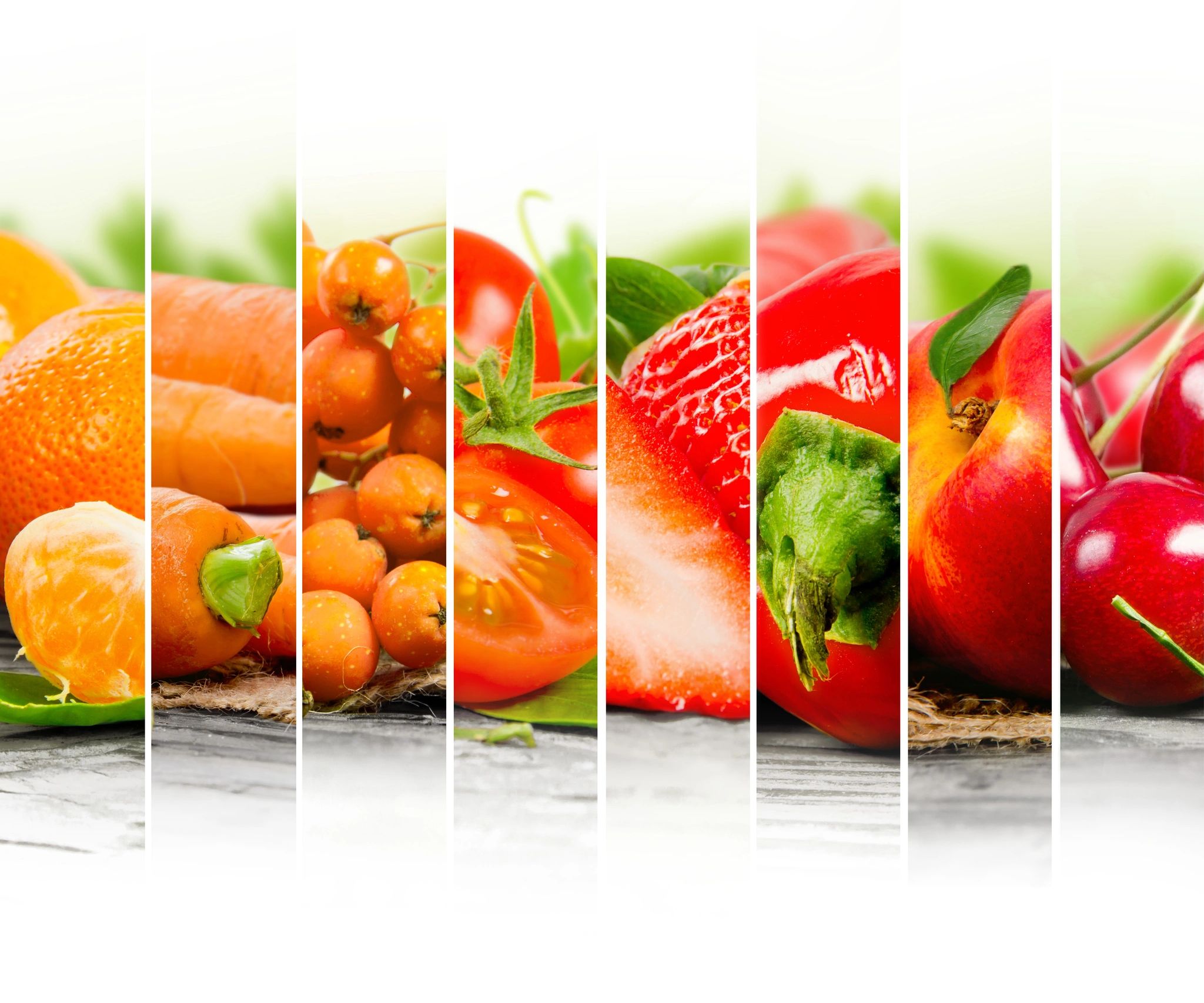 A variety of fresh fruits and vegetables split into vertical sections.