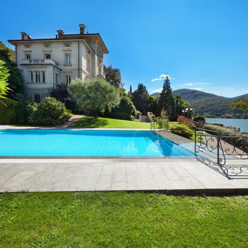 external of a villa, beautiful swimming pool overlooking the lake