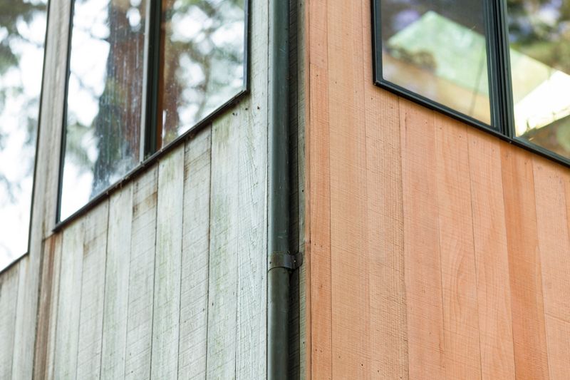 Before and after of redwood siding on home. Home repair