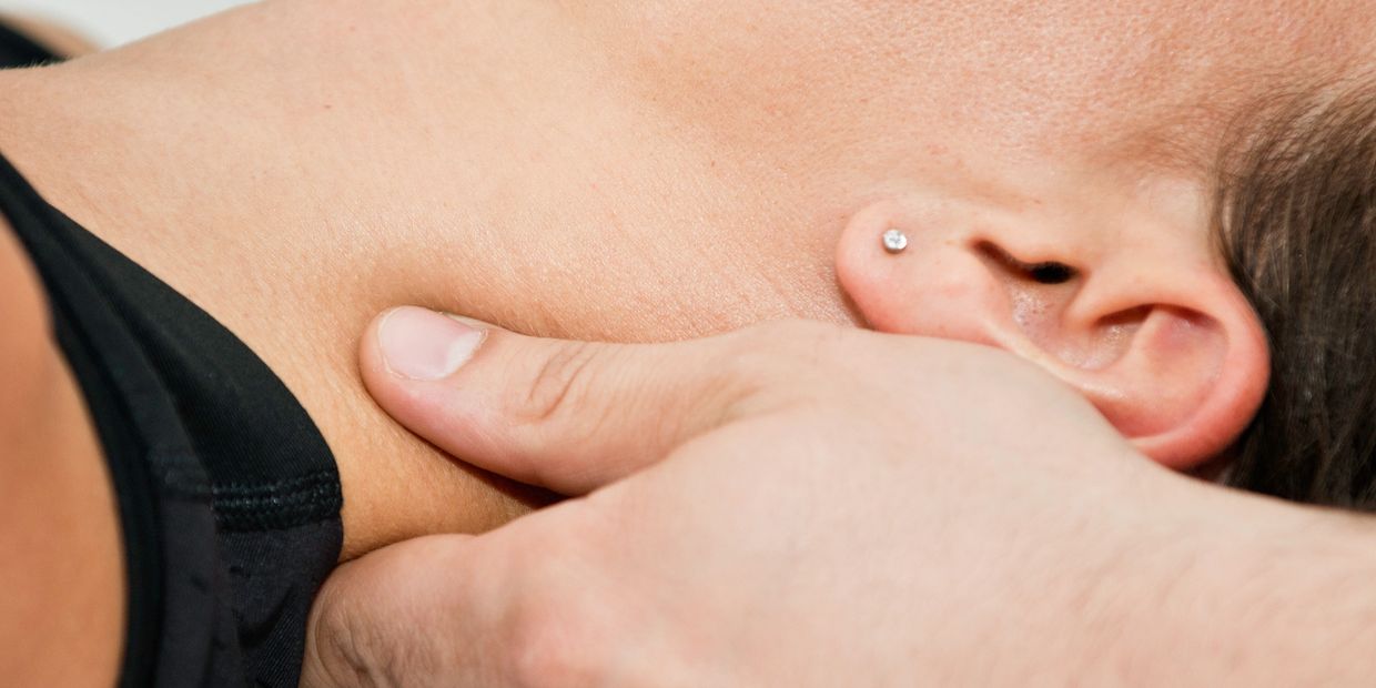 Massage therapist providing myofascial release therapy during a session at Wholly Spirit Hands.