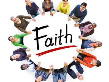 Diverse group holding a sign with the word 'Faith' underlined.