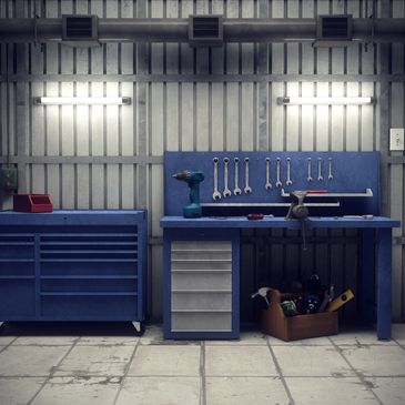 Organized workshop with tools, workbenches, and safety equipment.