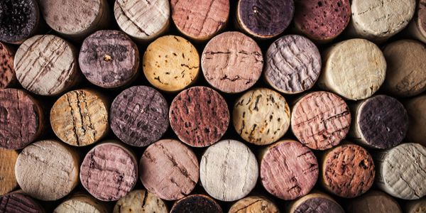 Close-up of tightly packed wine corks with varied textures and colors.