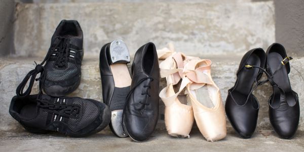 multiple dance shoes sitting on a step