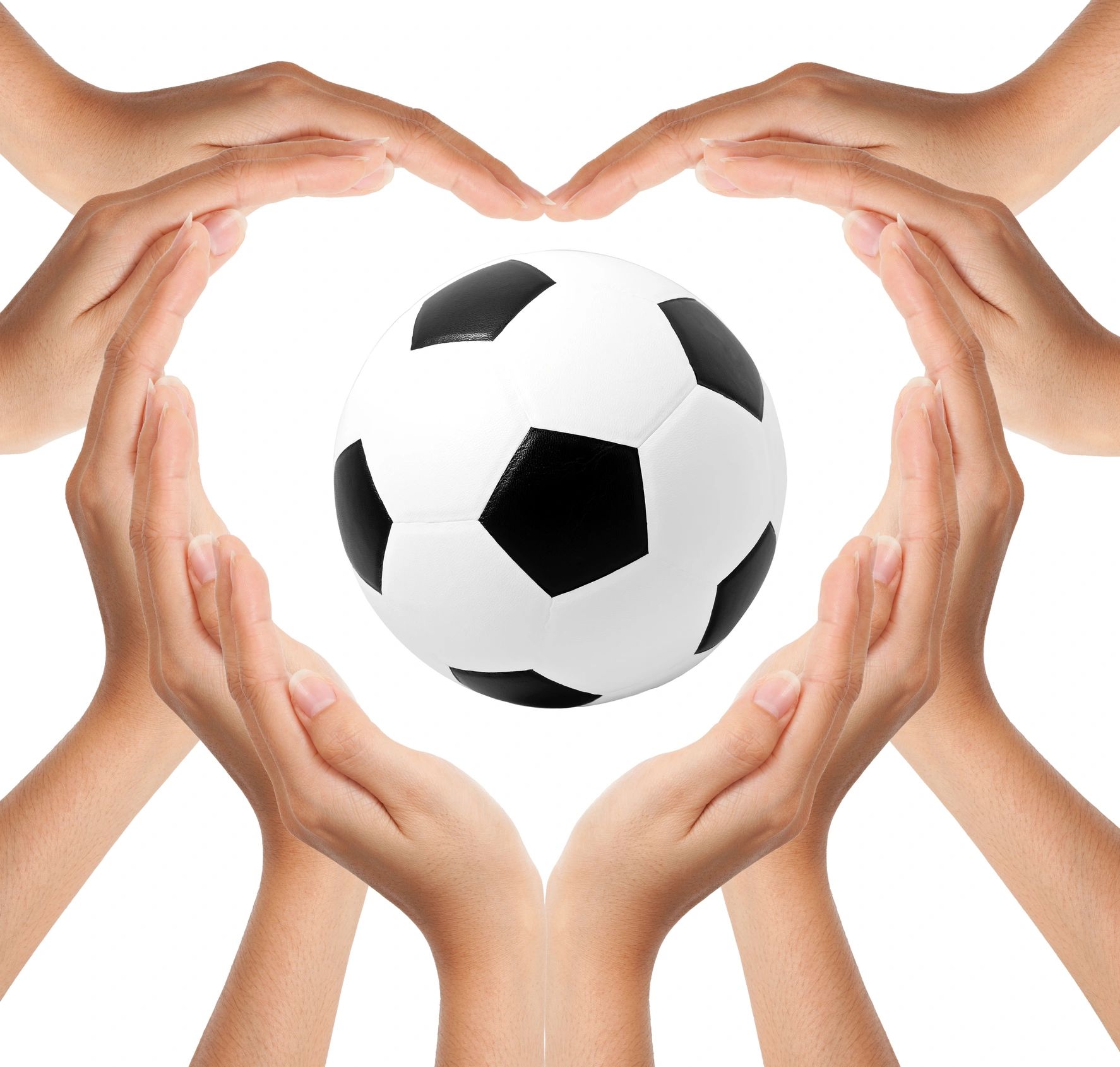 Hands forming a heart shape around a soccer ball on white background.