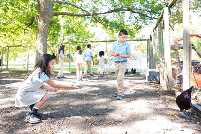 Children enjoying outdoor learning together.