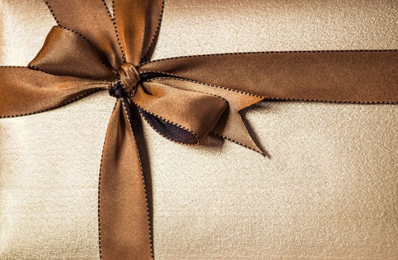 Christmas gift box with golden ribbon