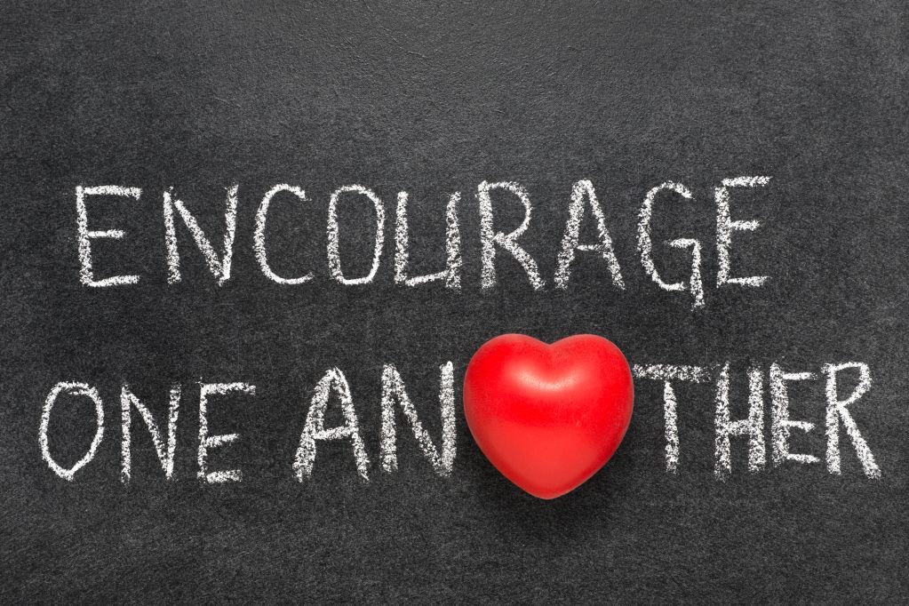 Message of encouragement with heart symbol on chalkboard.