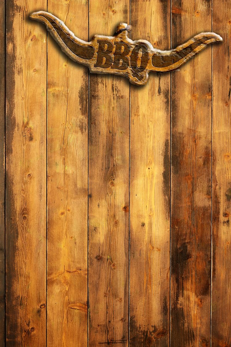 barbecue insignia with horns on a wooden wall