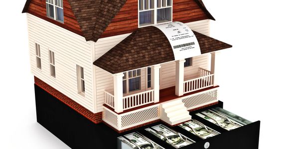A house with a receipt roof and cash drawers underneath.