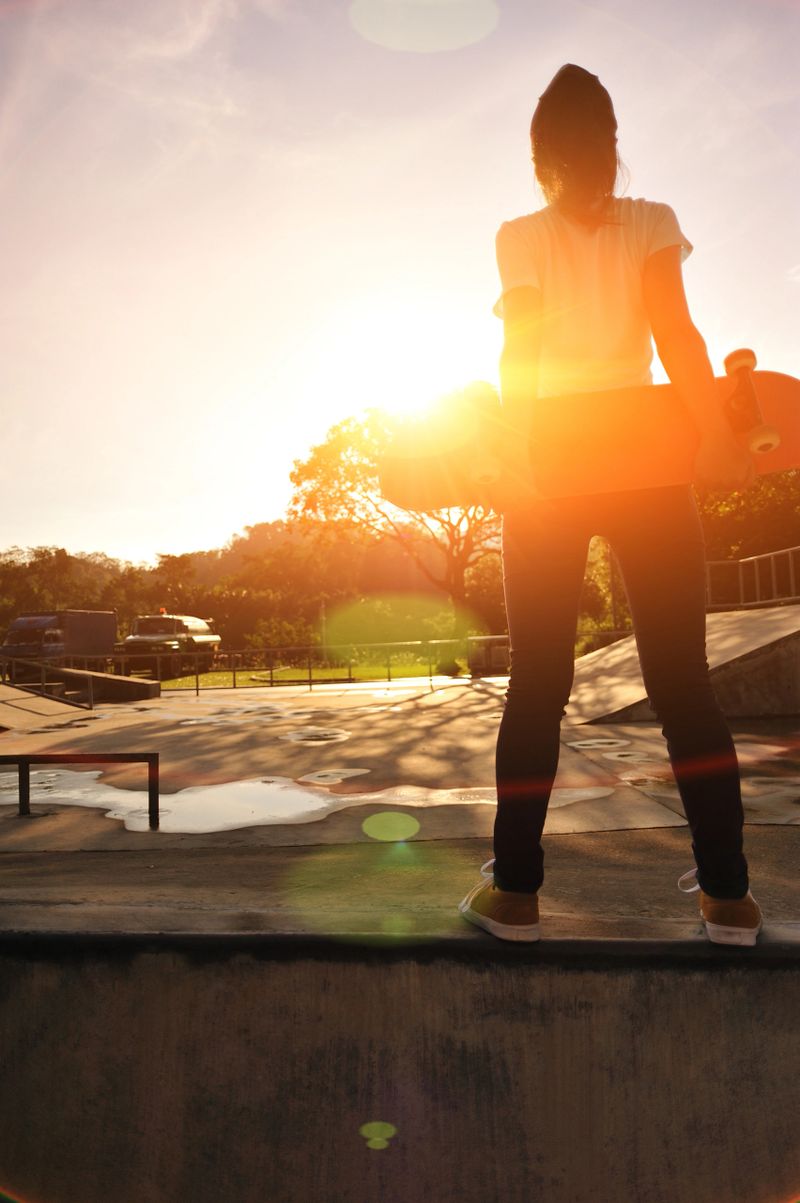 skateboarder at sunrise skatepark
