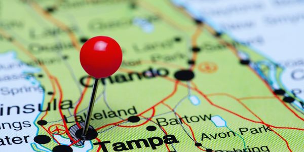 Red pin marking Tampa on a Florida map.