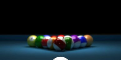 A rack of colorful billiard balls on a pool table.