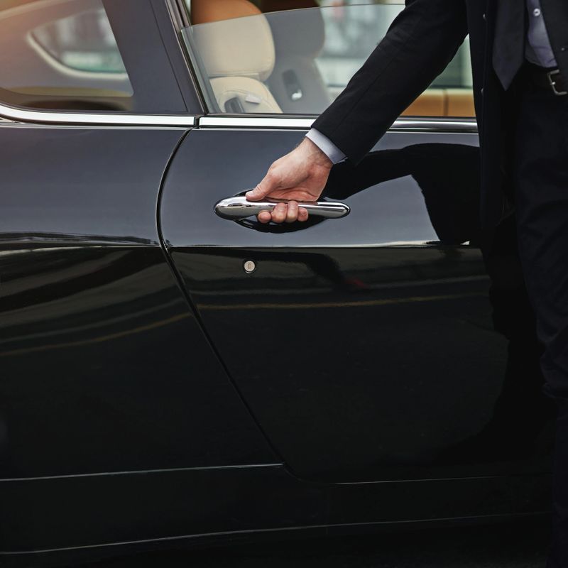 Cropped shot of a well dressed man opening a car doorhttp://195.154.178.81/DATA/i_collage/pi/shoots/806100.jpg