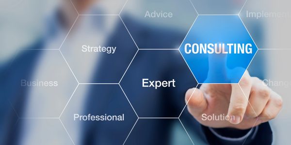 Businessman selecting consulting on a virtual hexagonal interface.