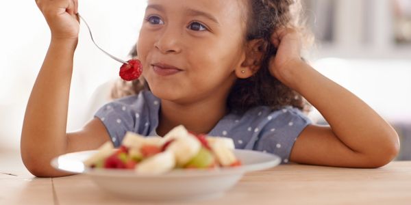 A Child eating nutritious food