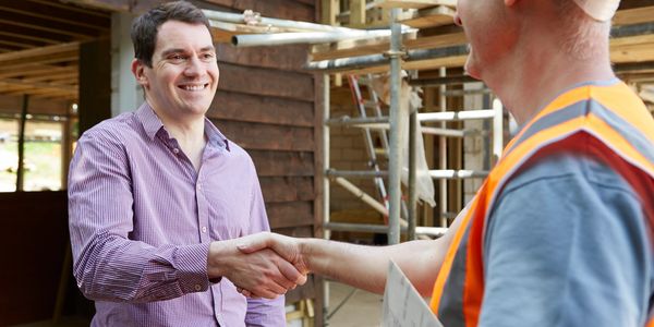 Client shaking hands with worker. 