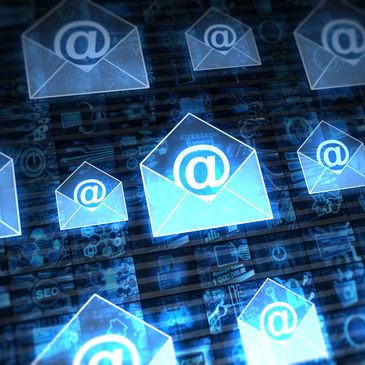 Glowing email icons with @ symbols representing digital communication.