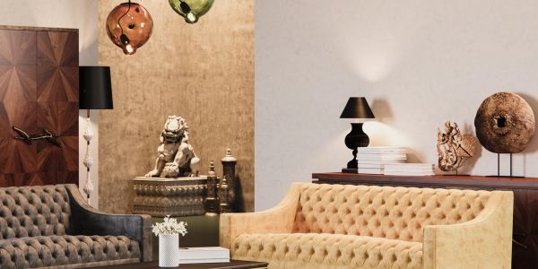 Elegant living room with beige and gray tufted sofas and artistic decor.